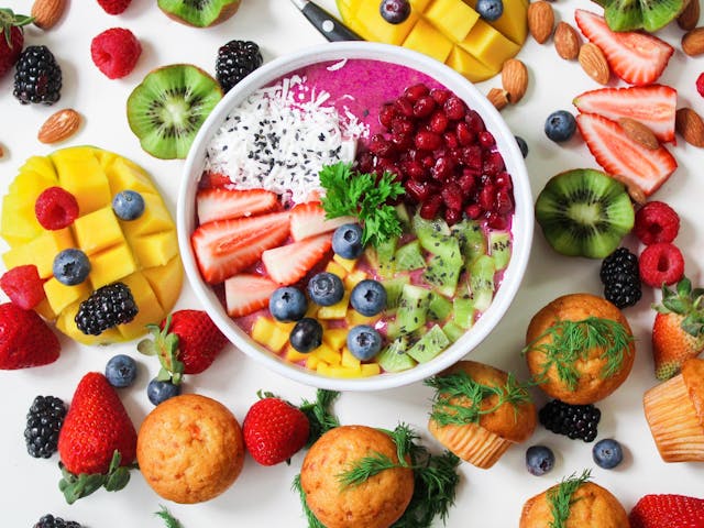 Energy Homeostasis: How Your Body Works to Balance Energy 6 Various health foods spread out on a white background