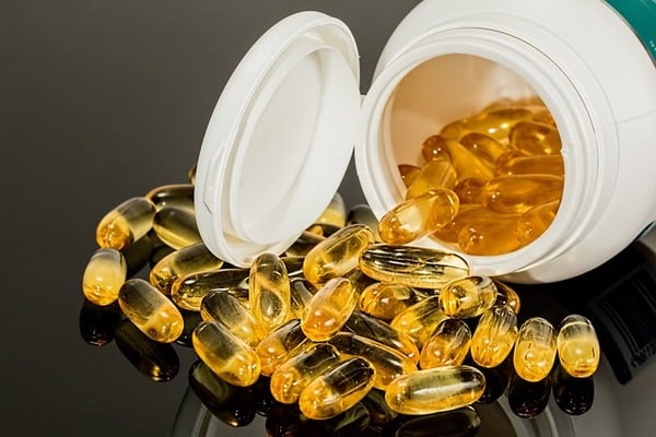 A bottle of fish oil capsules
