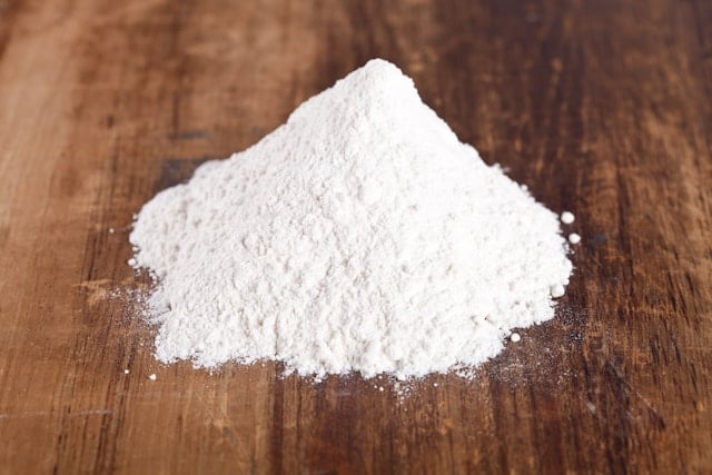 Reviewing Rhonda Patrick's Supplement Routine in 2025 5 Magnesium powder on wood table