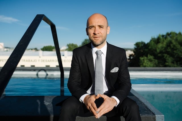 Reviewing Andrew Huberman's Supplement Routine in 2025 10 Man looking happy sitting outside