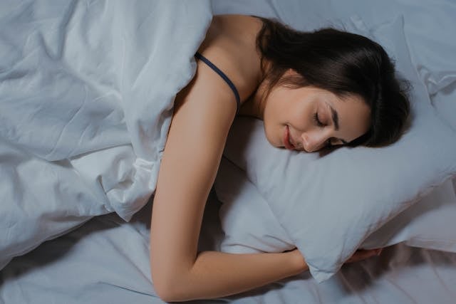 10 Ways to Increase Your NAD+ Levels 8 A woman sleeping peacefully