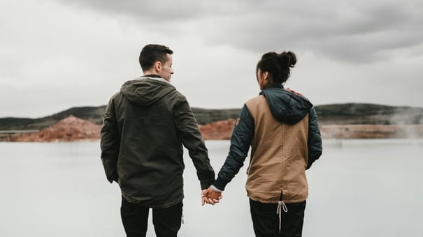 NAD Levels by Age Group: What's Considered Normal? 4 Middle-aged couple holding hands by the lake