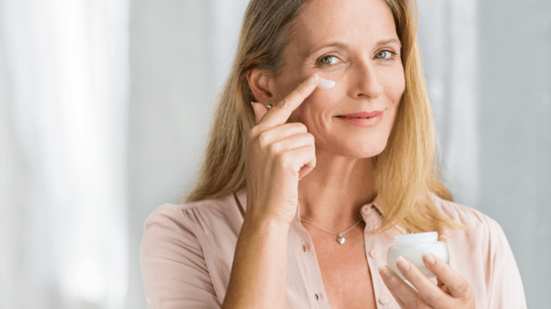 The Regenerative Benefits of NAD+ for Aging Skin 6 An image of a matured woman applying skin care