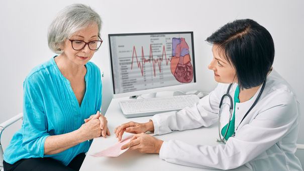 Does NAD+ Help With Menopause Symptoms? 10 An image of a glowing matured woman taking supplement