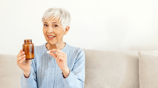 An image of a matured woman taking supplement