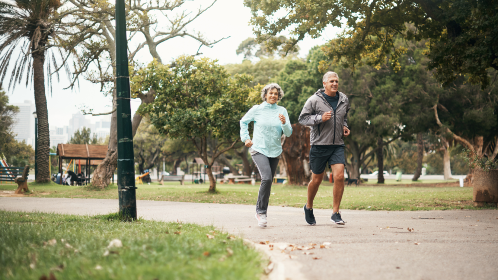 Picture of an old couple jogging. 