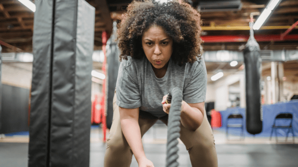 7 Anti-Aging Exercises for Longevity (and One Workout to Avoid) 9 An image of a woman, exercising HIIT