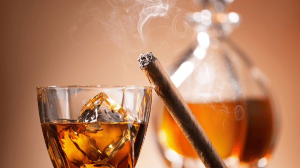 12 Diet and Lifestyle Secrets of Centenarians Who Live to 100 8 An image of alcohol and cigarette.