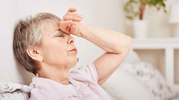 NMN with TMG: Benefits, Dosage and Risks 8 An image of a matured woman that might be suffering from a supplement side effect
