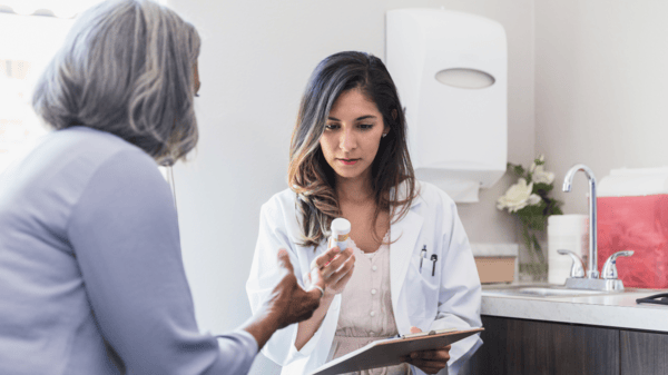 NMN Dosage Guide: How to Safely Take NMN 7 An image of a matured woman consulting to a doctor