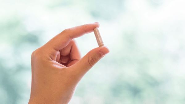 10 Creatine Myths Debunked by Science 16 An image of a hand holding supplement