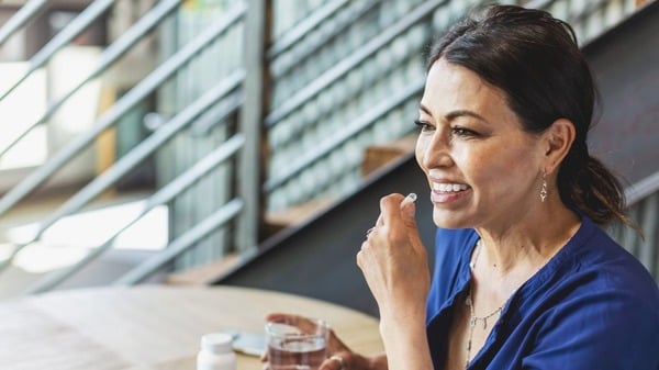 Fisetin: Benefits, Longevity Potential & Side Effects 9 An image of a woman taking supplement