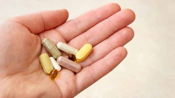 Boswellia vs. Turmeric: Differences, Benefits and Risks 10 An image of supplements in an open hand