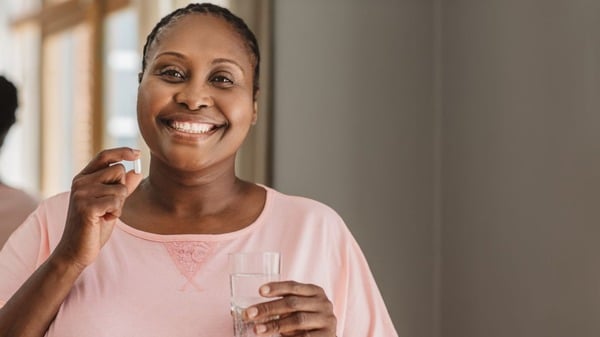 Cellular Degeneration: What It Is and Why It Matters 10 An image of a woman taking supplement