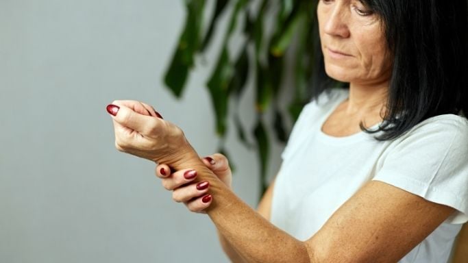 Inflammatory Biomarkers: What Do They Reveal? 5 Woman holding her wrist