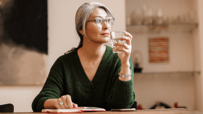 An image of a woman drinking water