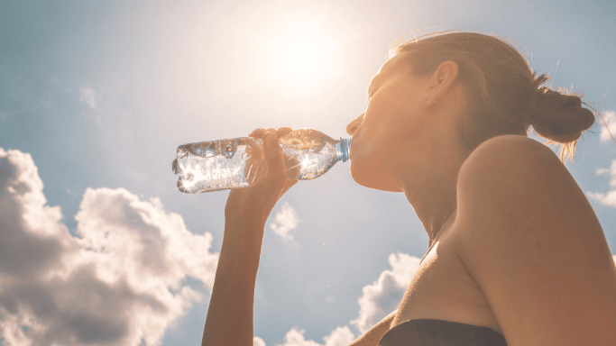 An image of a woman drinking water
