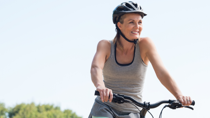 An image of a woman on a bike
