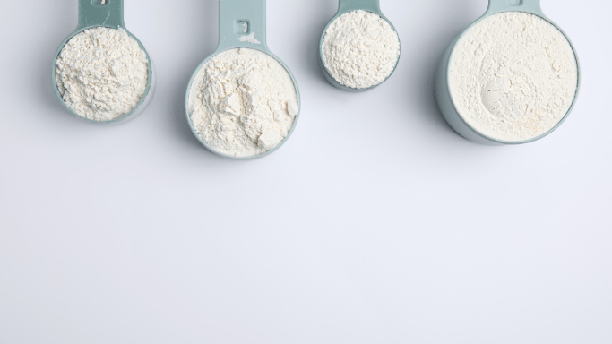 An image of creatine powder scoops