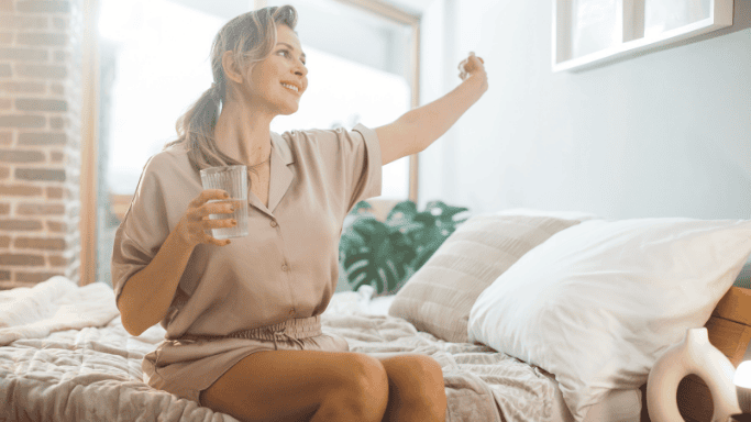 What to Know About Creatine and Sexual Health 10 An image of a matured woman holding a water while stretching her other hand