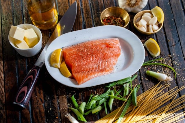 Should You Take Creatine on a Keto Diet? 8 A ketogenic dish of salmon surrounded by butter and lemons