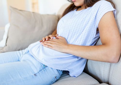 Homepage 74 A woman with bloating after her workout