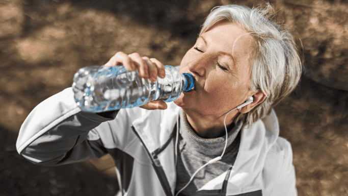 An image of a woman drinking water