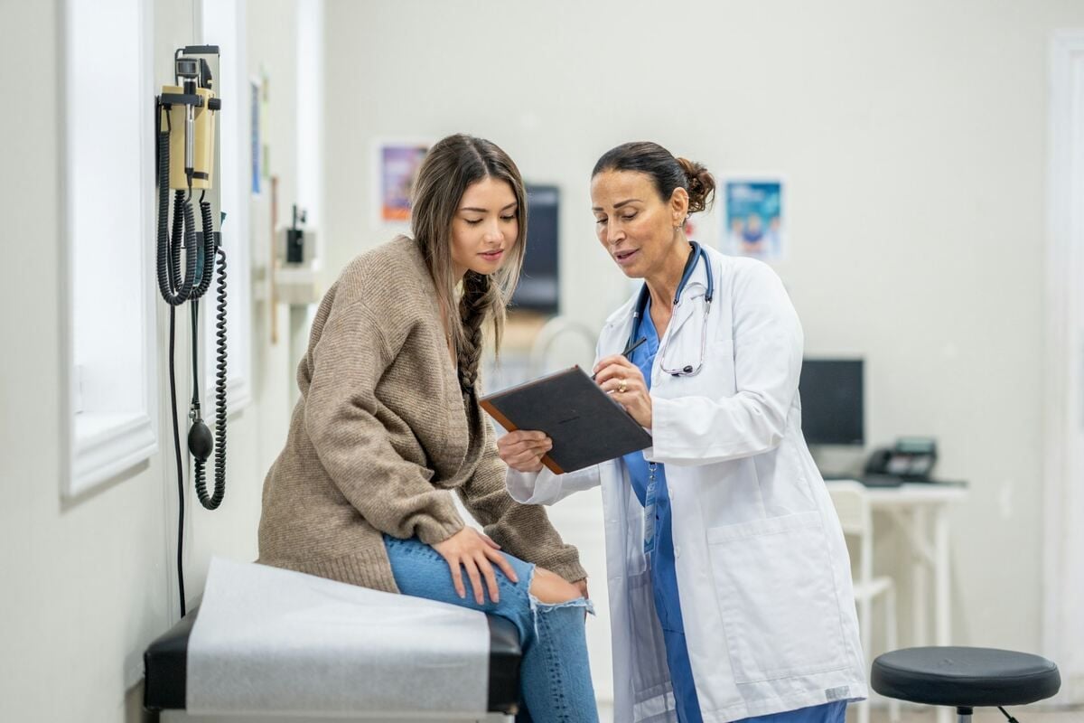 A woman receiving her D-dimer test results at a clinic