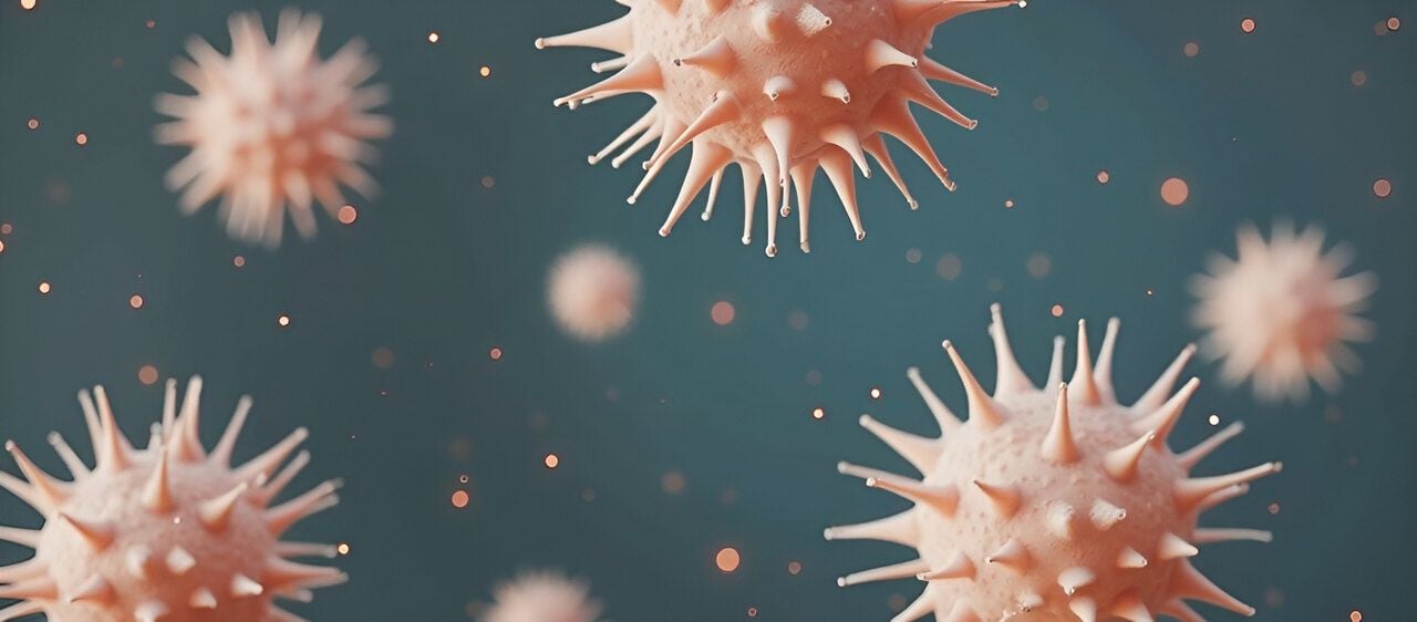 A representation of cell degeneration, pink deformed cells against a teal background