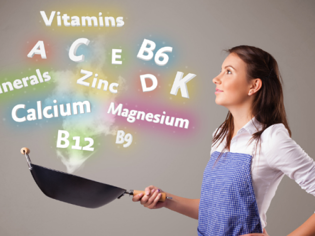 Woman holding a frying pan with colorful text representing essential anti-aging nutrients like vitamins A, C, D, E, B6, B12, and minerals such as calcium, magnesium, and zinc for aging well.