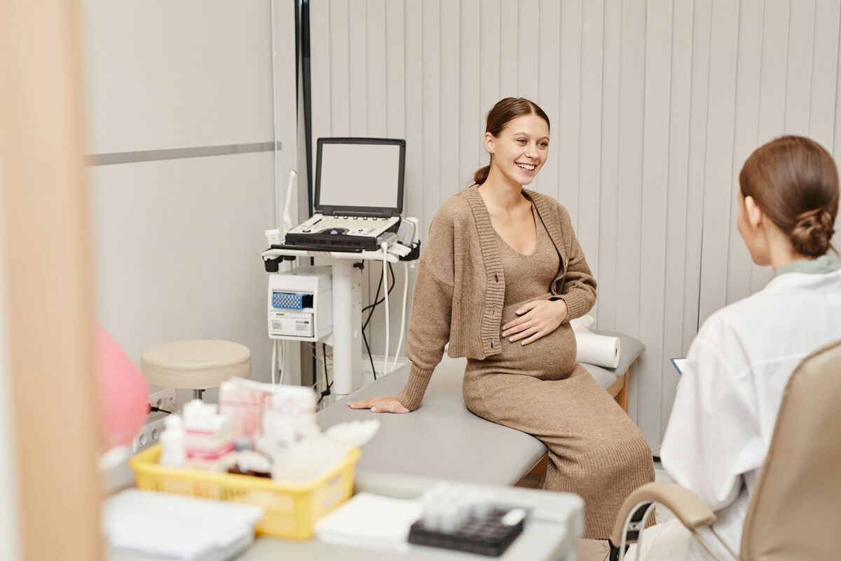A pregnant woman receiving progesterone test results