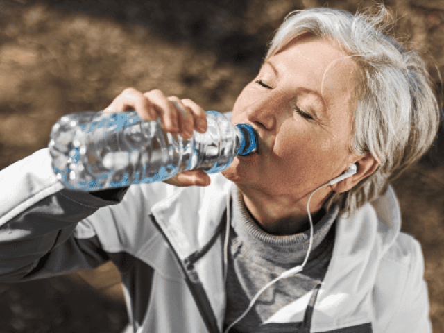 An image of a woman drinking water