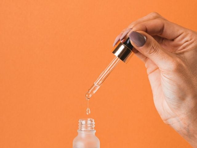 Niacinamide benefits - featured image showing serum dropper