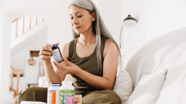 Senior woman taking supplements