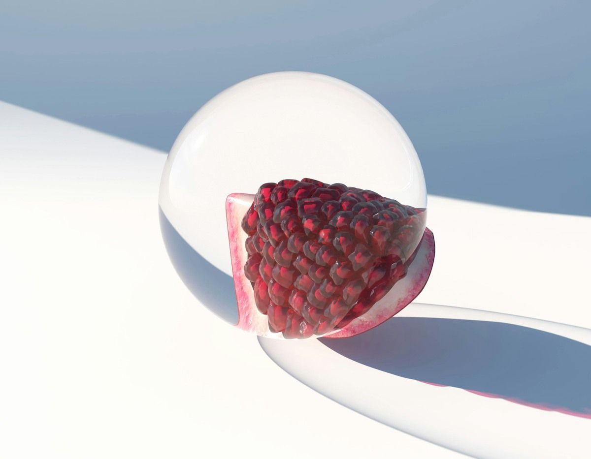 Pomegranate inside a sphere representing Urolithin A vs NAD+