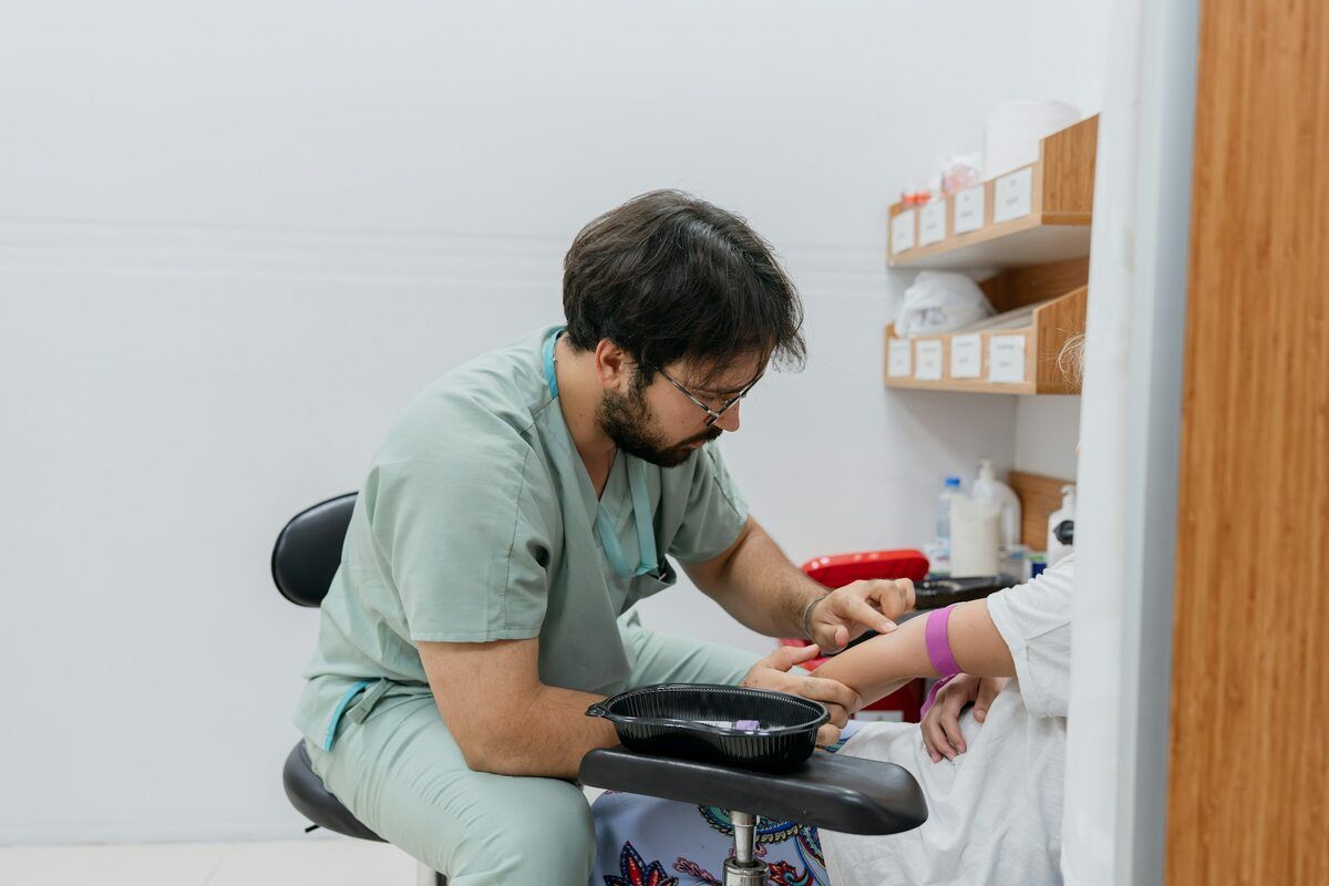 A patient receiving an eGFR blood test in a clinic