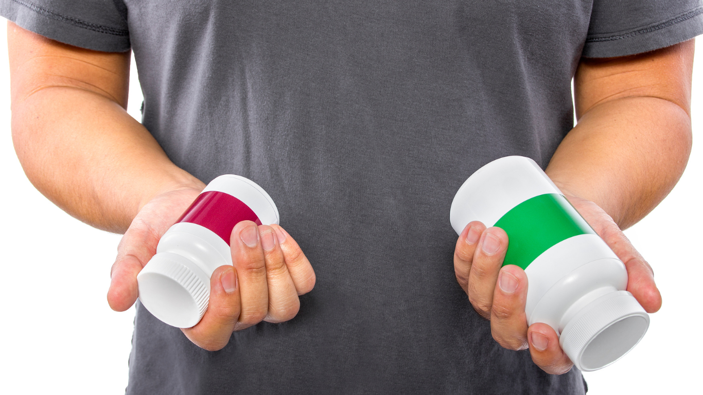 Man holding two supplement bottles