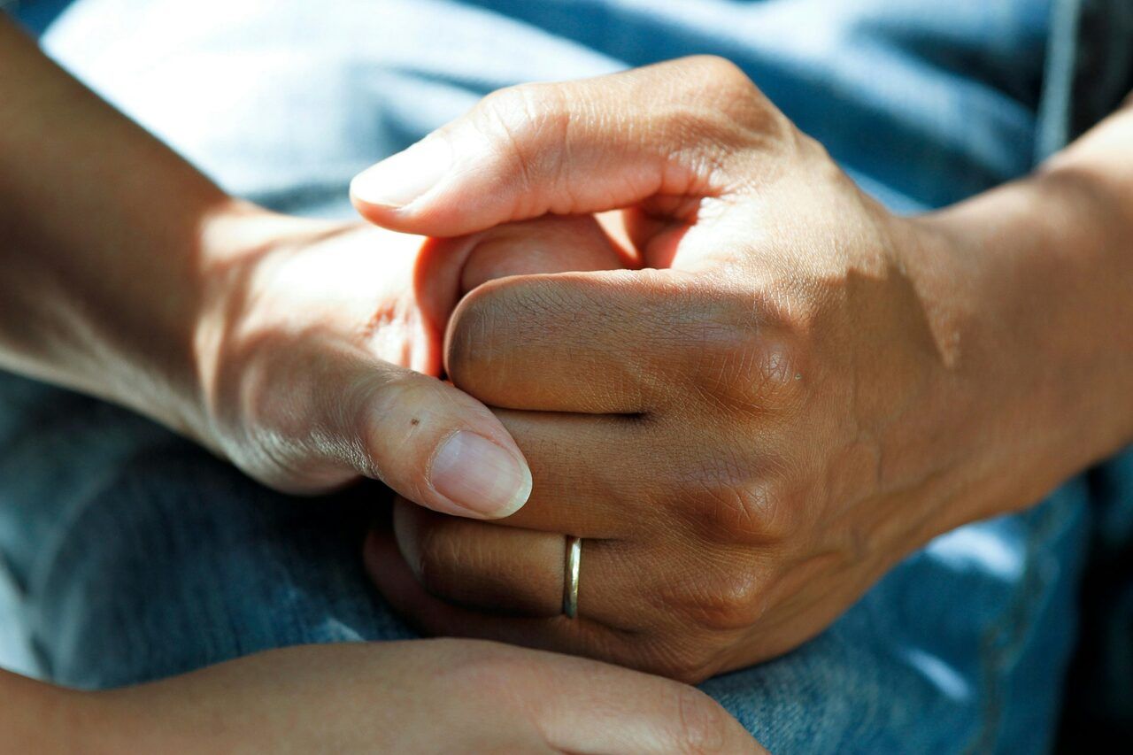 Closeup of holding a cancer patient's hand