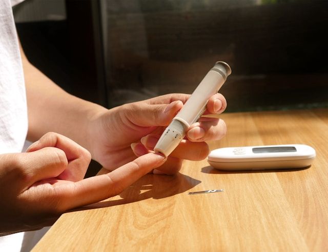 A person taking a blood sugar test