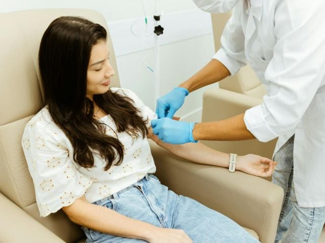 A woman gets a blood test during her period