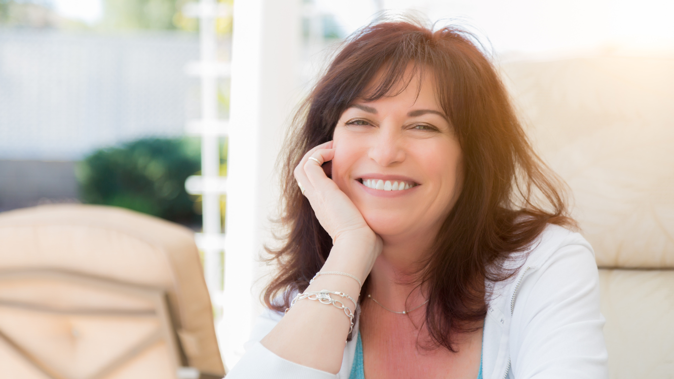 An image of a happy matured woman aging gracefully
