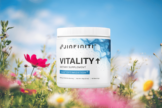A white supplement container labeled "Vitality NAD+ Booster" sits among colorful wildflowers against a blue sky background.