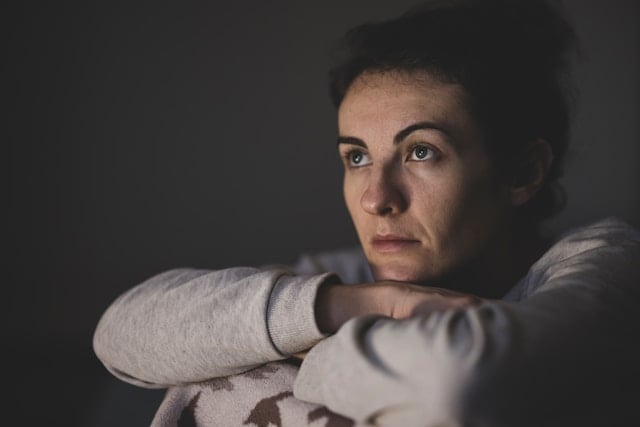 A woman in a contemplative or melancholic mood