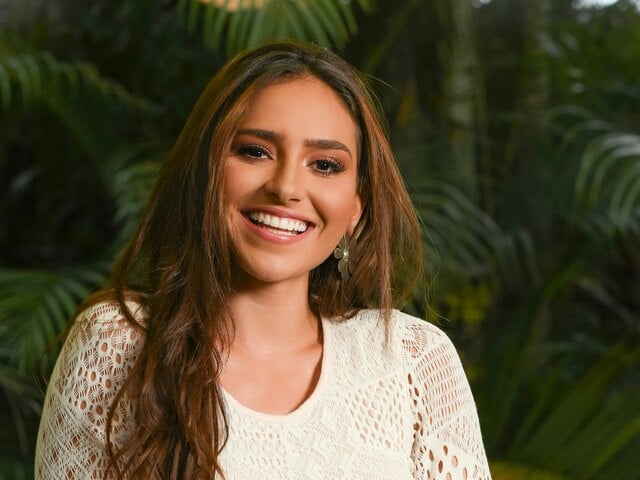 Smiling woman with glowing energy