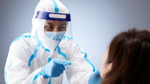 An image of covid-19 patient receiving a swab