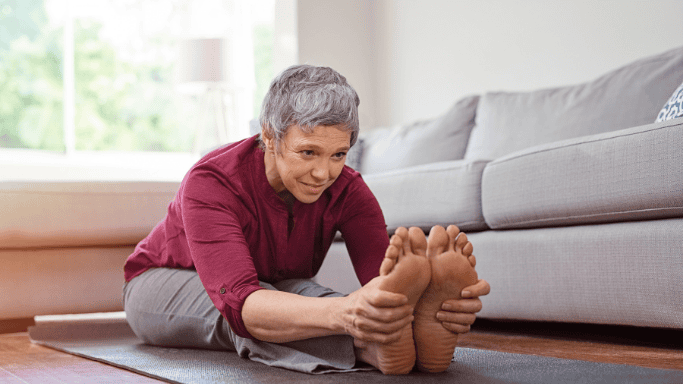 An image of a woman exercising her foot joints