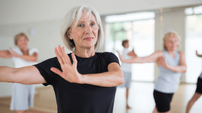 A senior woman doing physical therapy classes