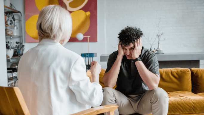An image of a man undergoing therapy for addiction