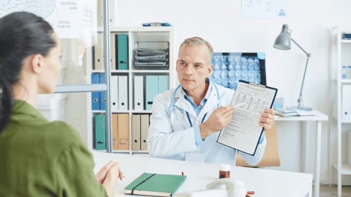 An image of a doctor explaining to a patient