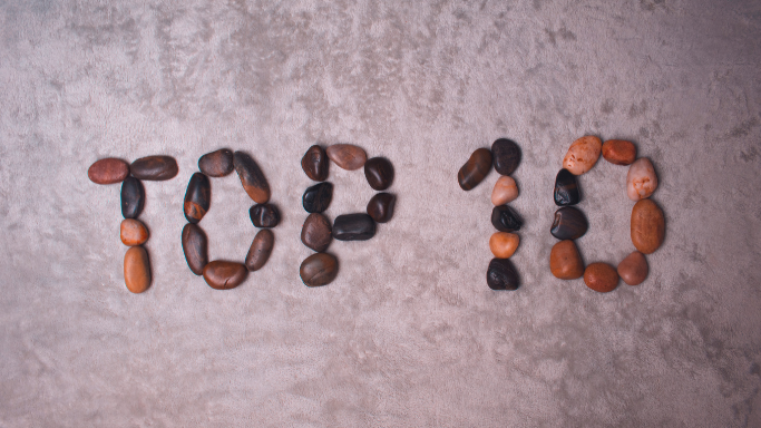 An image showing 'Top 10' spelled out using multicolored stones.